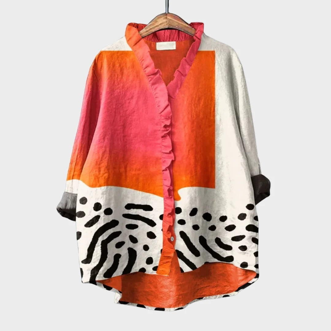 FARAMOND BERLIN abstract print shirt with ruffle trim, V-neck, button-down front, long sleeves, in orange, pink, white, and black.